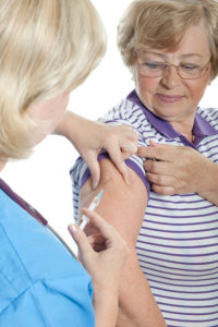 staff injecting the patient